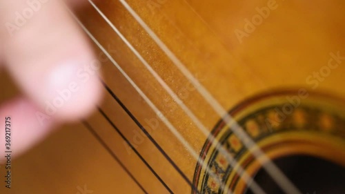 playing guitar brown close-up play-boy