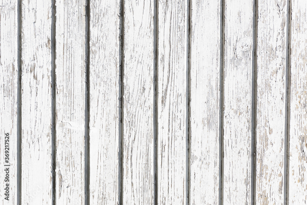 White wood background. Grunge peeling paint. Cracked wooden desk background. Vintage board pattern. White wood background. Grunge peeling paint. Cracked wooden desk background. Vintage board pattern.
