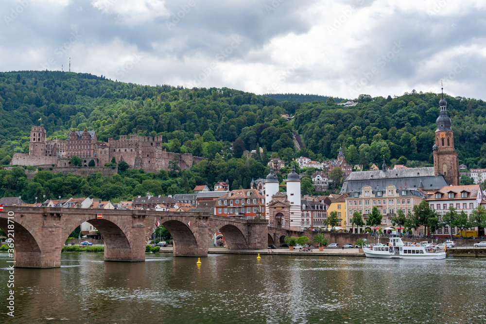 view of the historic old town of Heidelberg with the pedestrian bridge and palace