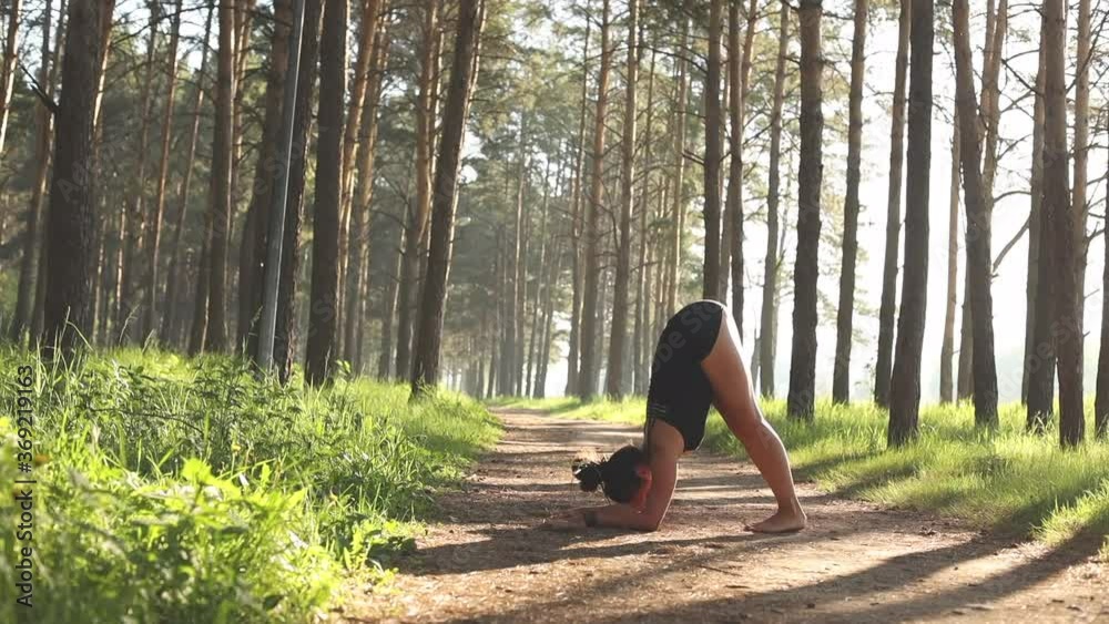Young girl doing yoga fitness exercise outdoor. Morning sunrise. Meditation and relax Young girl doing yoga fitness exercise outdoor. Morning sunrise. Meditation and relax