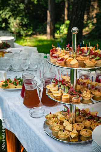 catering in a country restaurant on a glade. Tables served with tablecloths 