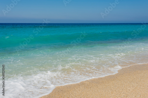  blue sea  white wave and clean sand on the cleopatra beach in alanya 