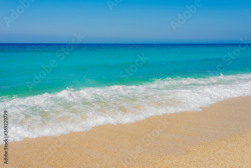  blue sea, white wave and clean sand on the cleopatra beach in alanya 