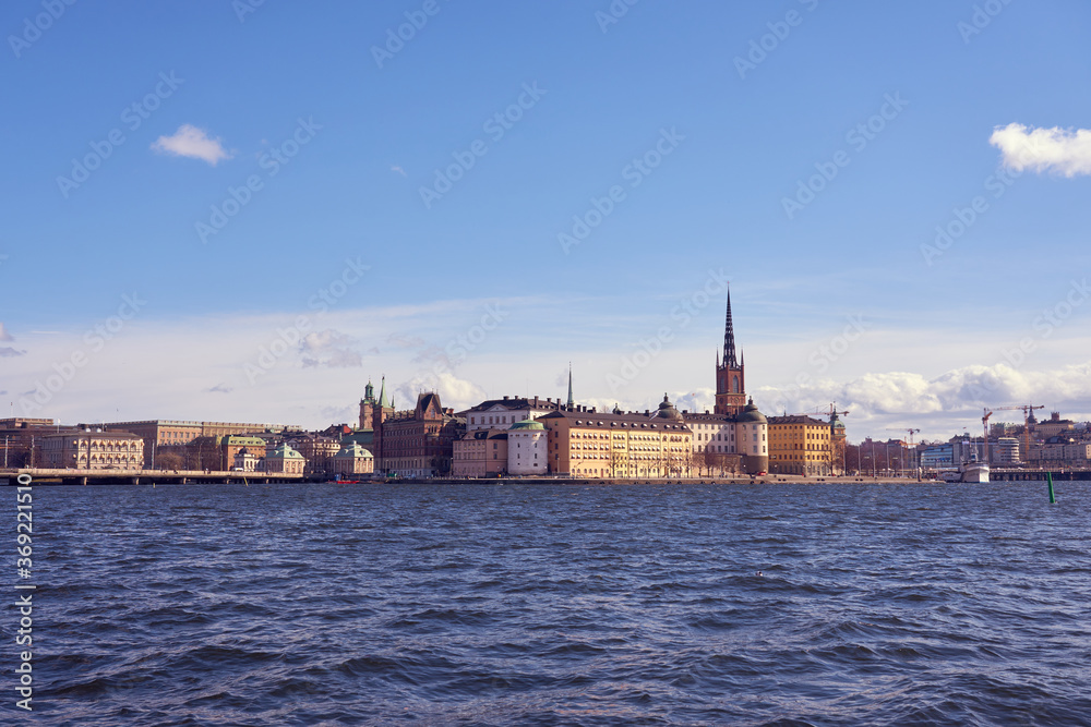 Old city of Stockholm under the blue cloudy sky.