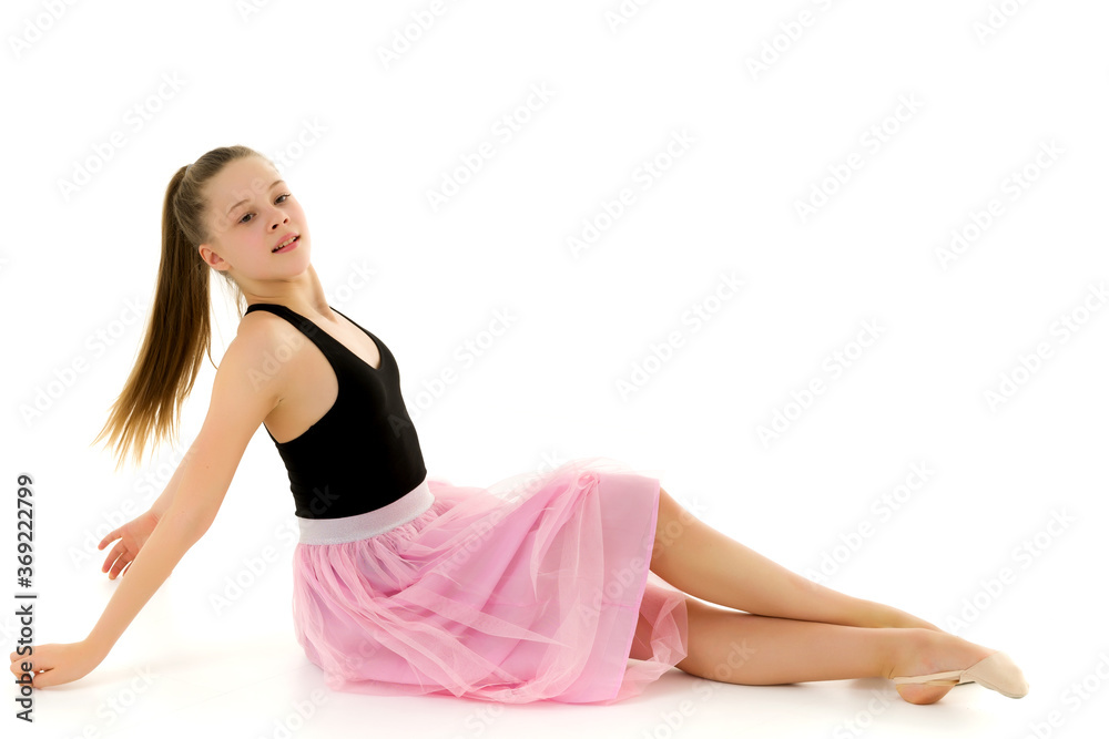 Blonde Girl in Stylish Tulle Dress Sitting on the Floor Blonde Girl in Stylish Tulle Dress Sitting on the Floor