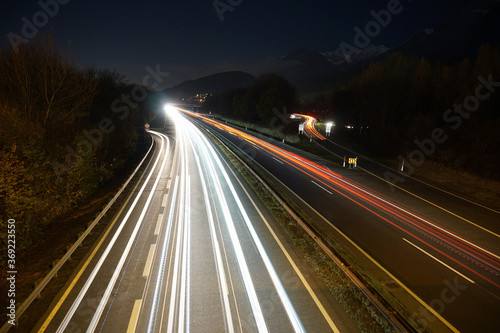Night car light trails long exposure shot with mountain range scenerie