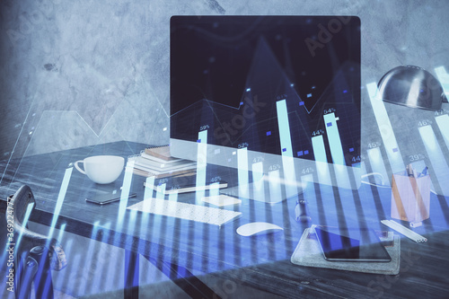 Stock market graph and table with computer background. Multi exposure. Concept of financial analysis.