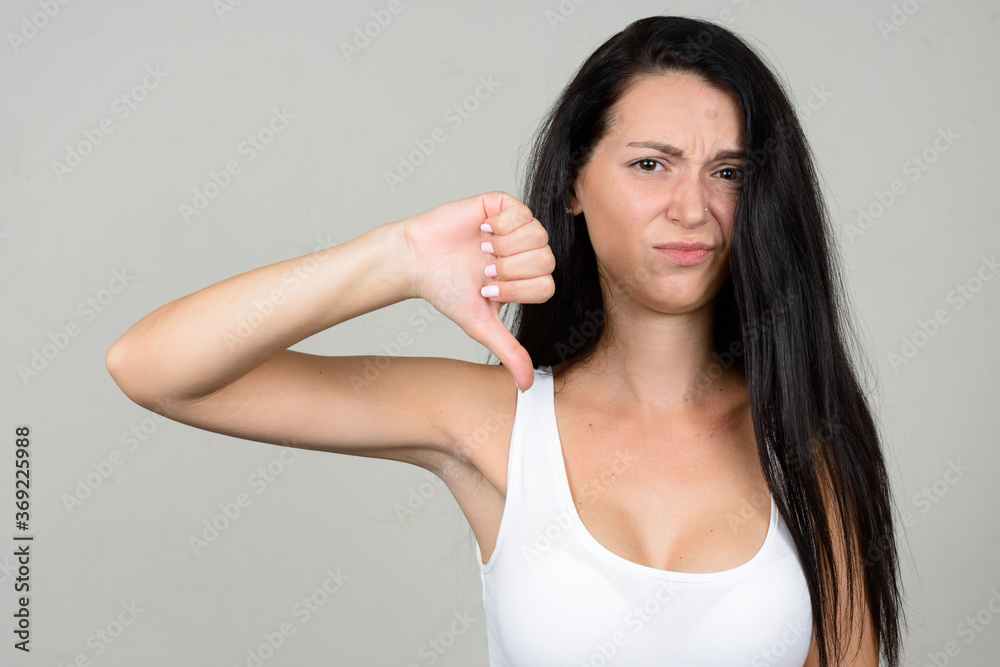Portrait of stressed woman against white background Portrait of stressed woman against white background