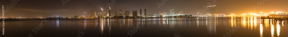 Panorama of San Diego Waterfront at night, as seen from Coronado Island, California, USA