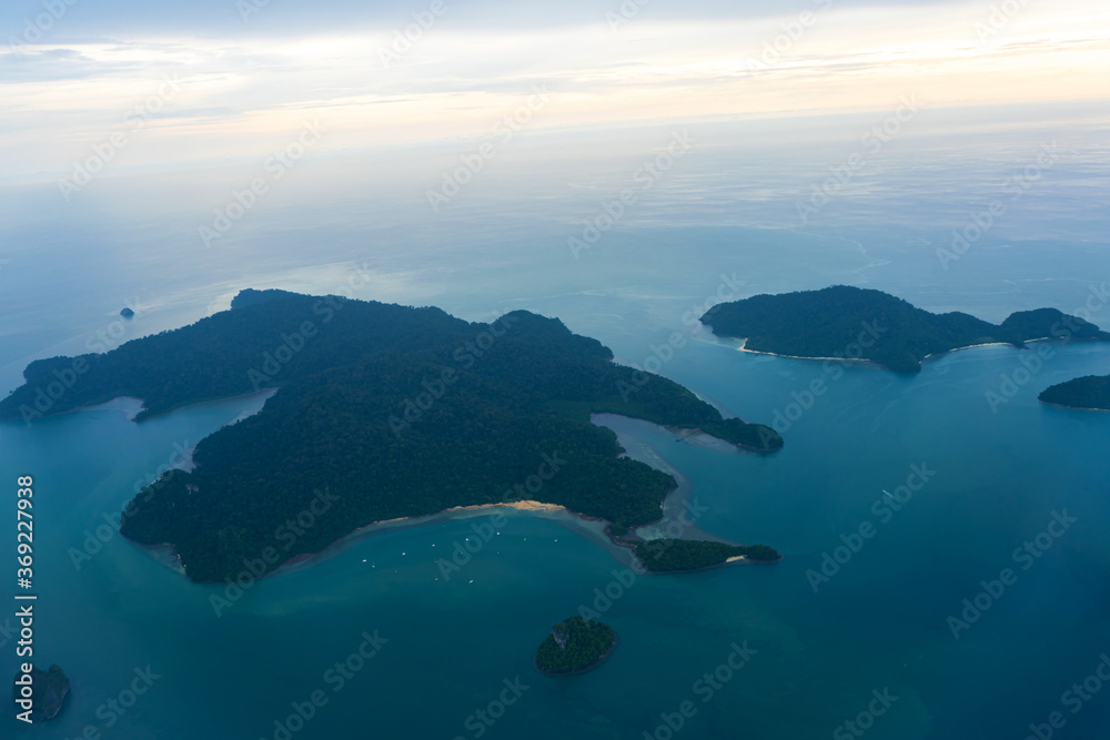 Small tropical islands aerial view from airplane.