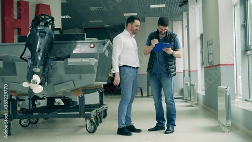 Purchase of a speedboat is getting done by a man photo