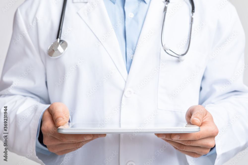 Digital tablet in hands of doctor, free space for hologram Digital tablet in hands of doctor, free space for hologram