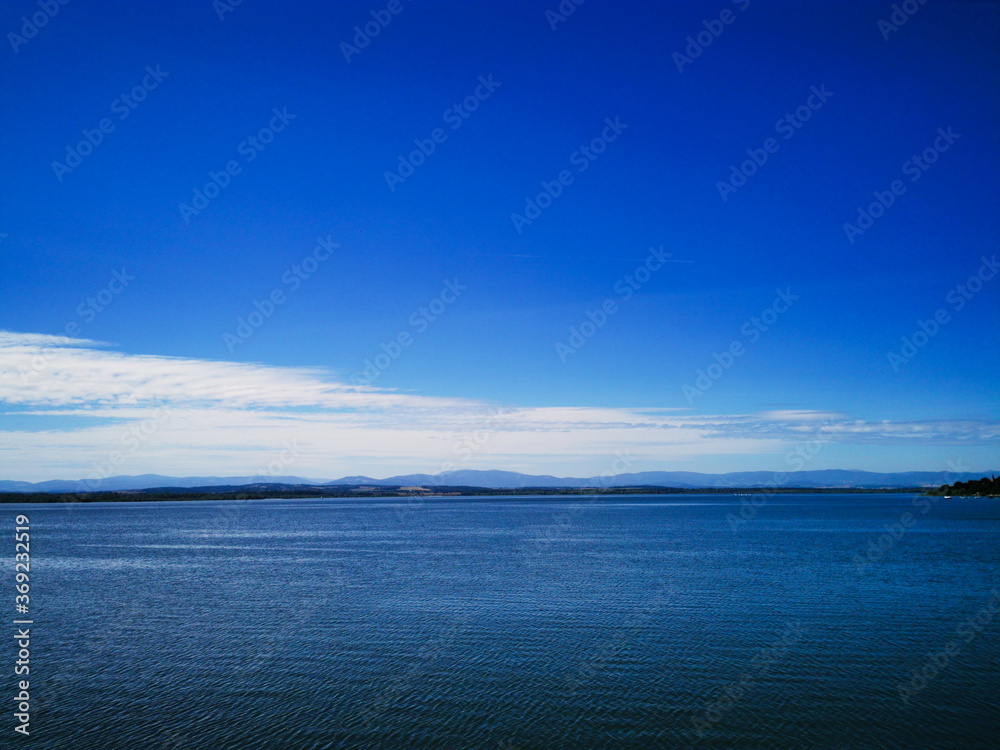 View of the Nysa lake in the background of the blue sky.
