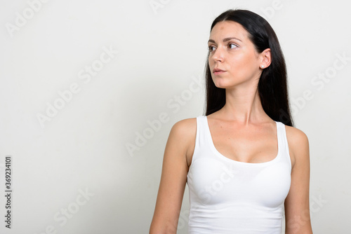 Portrait of beautiful woman against white background