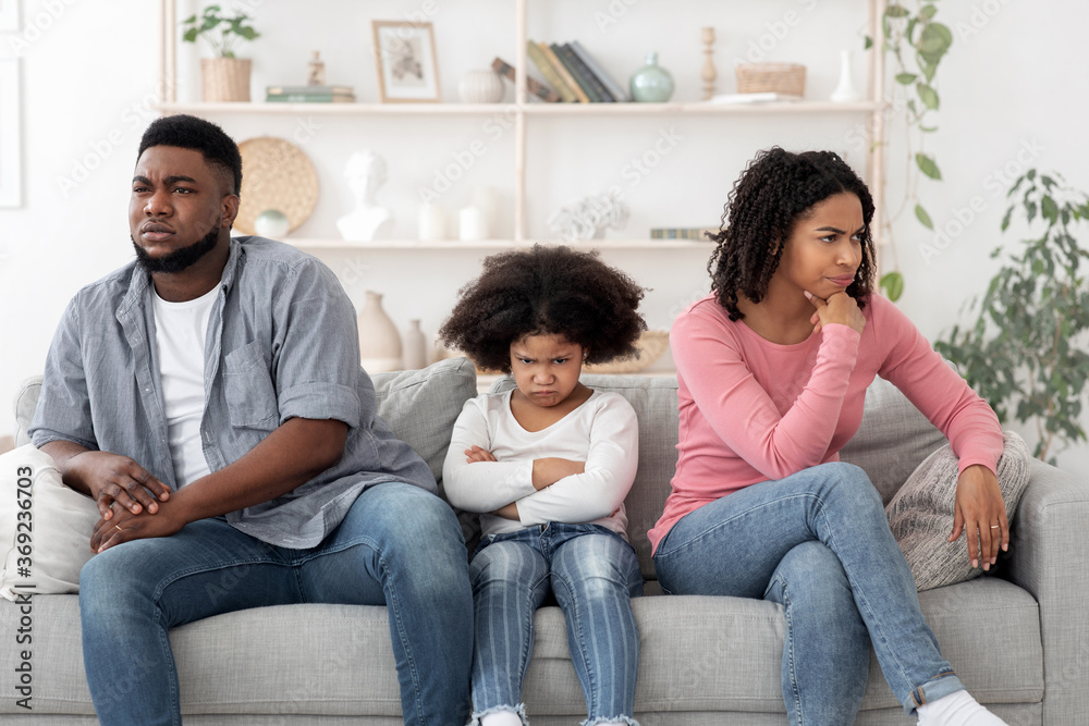 Family Misunderstanding. Black Parents And Little Daughter Ignoring Each Other After Argue Family Misunderstanding. Black Parents And Little Daughter Ignoring Each Other After Argue