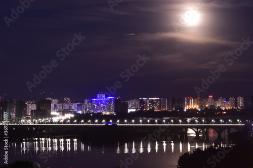 Night cityscape with moon. Residential district of Kyiv  Ukraine.