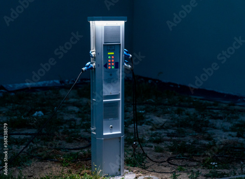 Schilderij op canvas view of an charging station for electricity in an RV park in Europe with the CEE