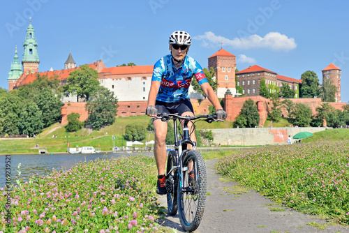 Fototapeta Naklejka Na Ścianę i Meble -  A man on a mountain bike- Cracow- Poland.