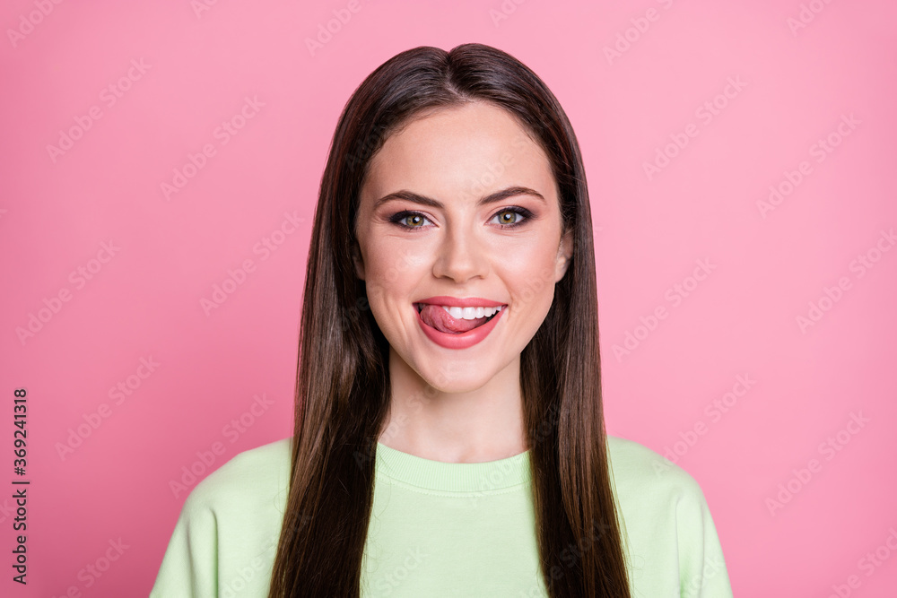 Closeup photo of funny attractive lady straight long hairdo funny girlish licking lips tongue see tasty dessert wear casual green sweatshirt pullover isolated pink color background Closeup photo of funny attractive lady straight long hairdo funny girlish licking lips tongue see tasty dessert wear casual green sweatshirt pullover isolated pink color background
