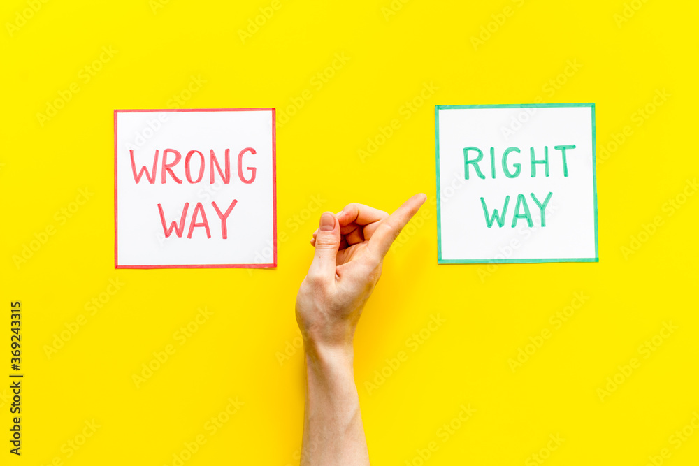 Choice concept. Right and wrong way icons, female hands choose top view Choice concept. Right and wrong way icons, female hands choose top view