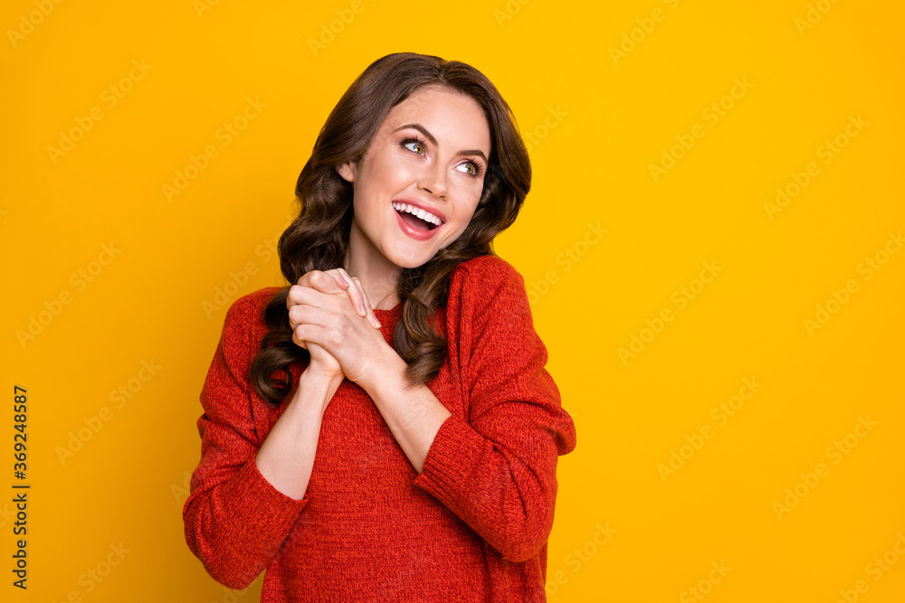 Portrait of excited energetic girl put hands fist together look copyspace enjoy long wait want hope sales ads wear jumper isolated over shine color background