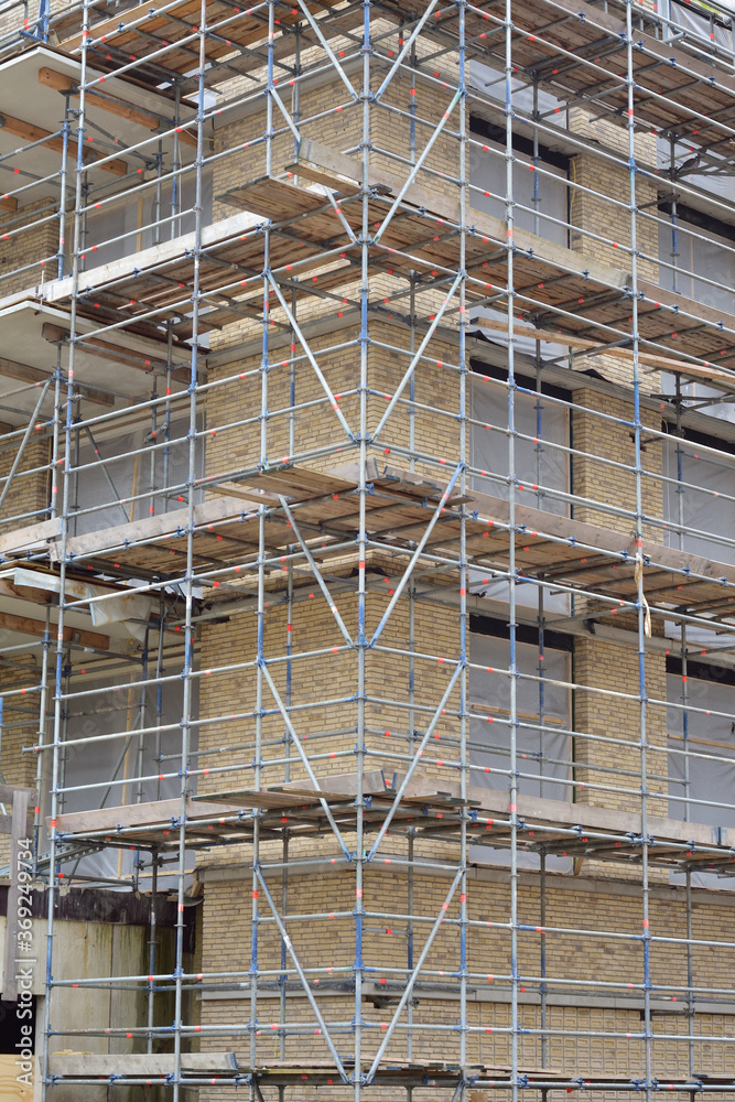 Construction scaffolding on the facade of a residential building.