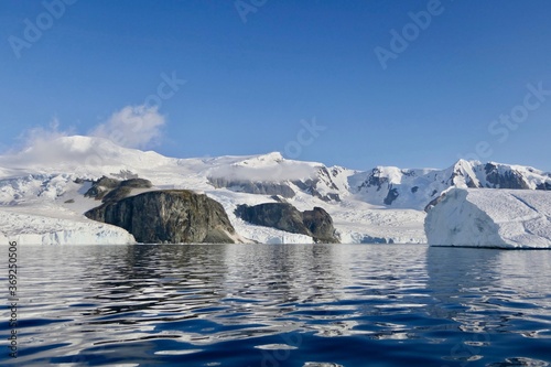 Antarctic landscape, glacier and mountain reflection in water, Antarctica