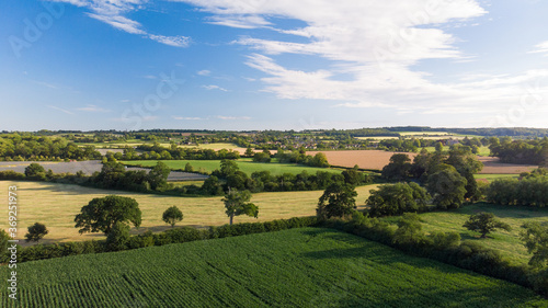 Aerial shot of green agricultural farmers fields near Glastonbury, Somerset. 