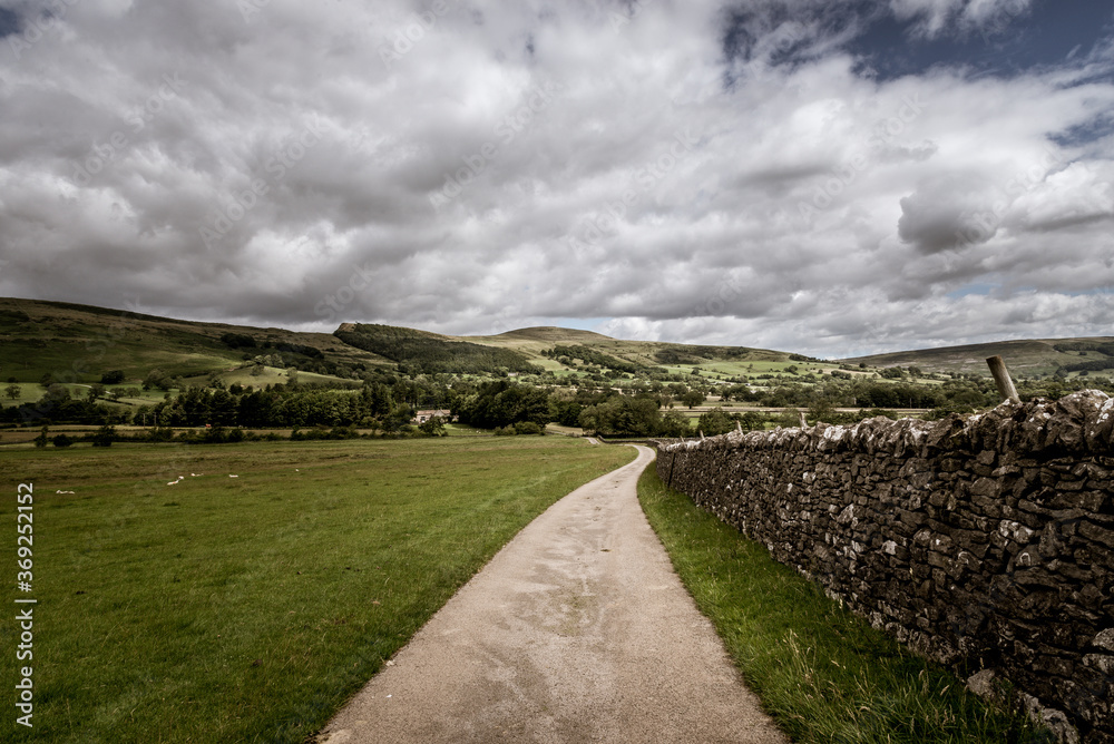 clouds over the fields and road