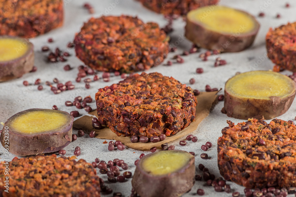 Sweet potato vegan burgers aduki light background. selective focus Sweet potato vegan burgers aduki light background. selective focus
