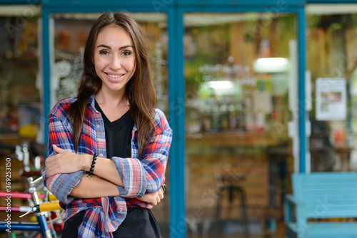 Wallpaper Mural Young beautiful hipster woman at the coffee shop outdoors Torontodigital.ca