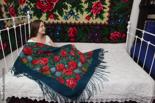 Billede på lærred Look of beautiful girl in vintage russian Pavlovo Posad shawl (scarf) and retro interior with old bed