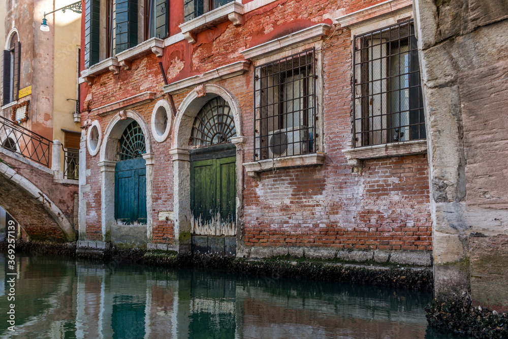 The entrances on the water channels of the old palaces in Venice, as seen from a gondola The entrances on the water channels of the old palaces in Venice, as seen from a gondola