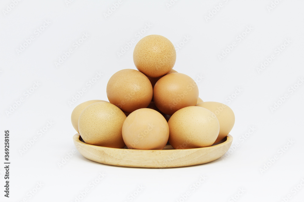 eggs in a wooden plate eggs in a wooden plate