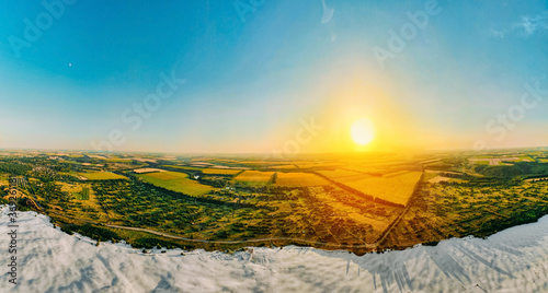 Border of desert and green meadow is a result human destructive activity in nature. photo