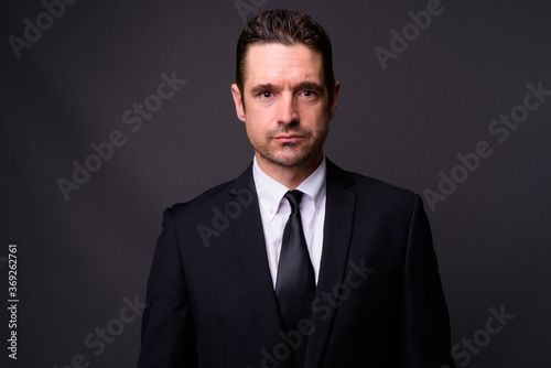 Portrait of handsome bearded businessman in suit