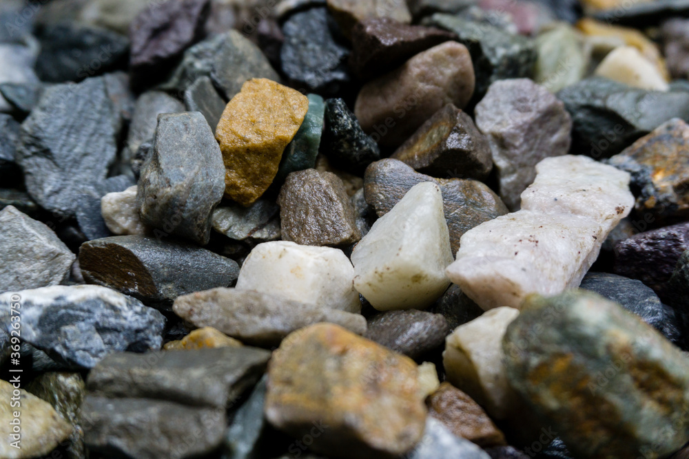 A close up shot of colorful gravel. Gravel is a loose aggregation of rock fragments. A close up shot of colorful gravel. Gravel is a loose aggregation of rock fragments.