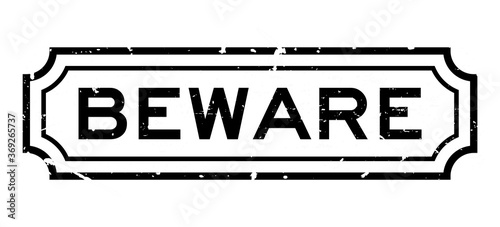 Grunge black beware word rubber business seal stamp on white background
