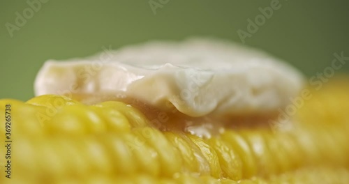 sweet farmhouse boiled corn and butter melt on it. close-up, studio shooting with macro lens