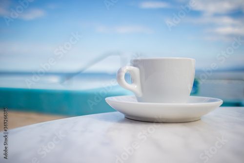 Cup of coffee at Swimming pool outdoors