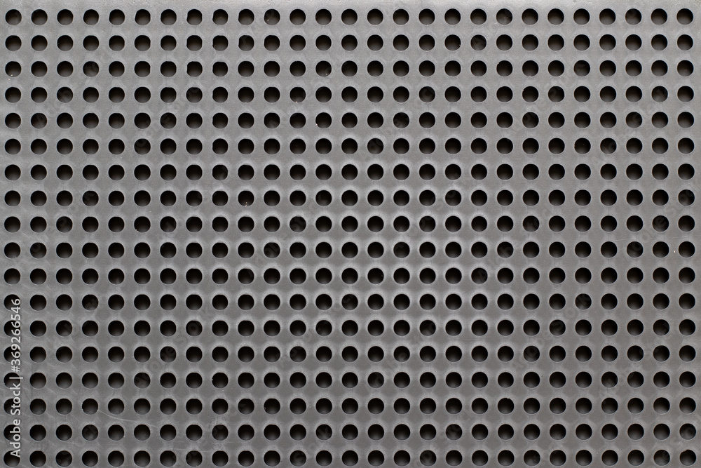 Blank color plastic pegboard texture background with copy space Blank color plastic pegboard texture background with copy space