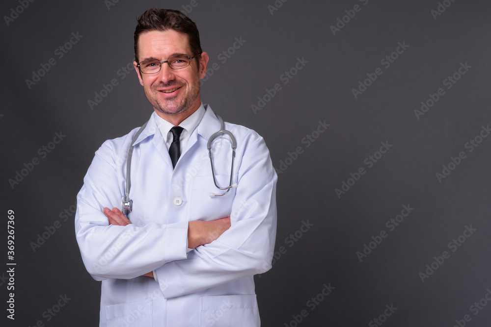 Portrait of happy handsome bearded man doctor Portrait of happy handsome bearded man doctor