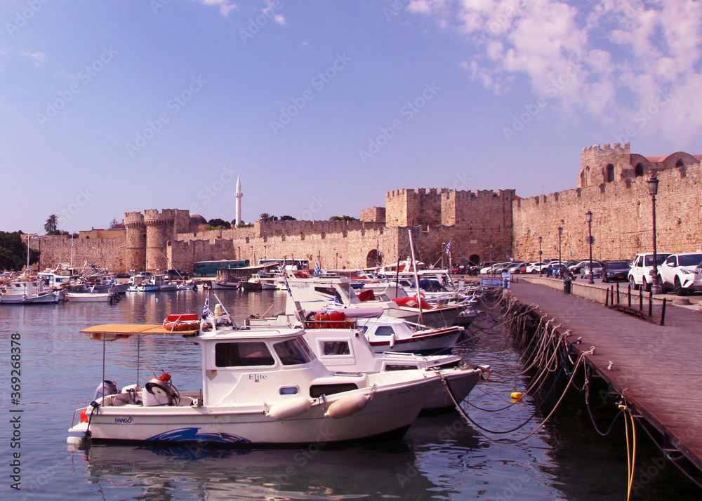 Rhodes, embankment and boats in Mandraki harbour, Rhodes, Greece