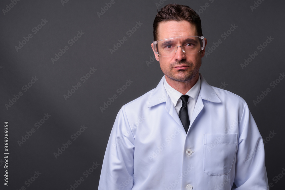 Portrait of handsome bearded man doctor as scientist Portrait of handsome bearded man doctor as scientist