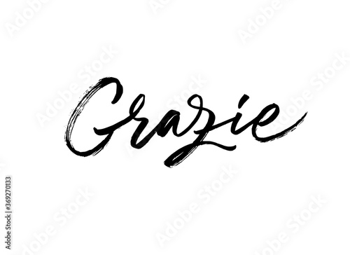 Grazie ink brush vector lettering. Thank you in Italian. Modern phrase handwritten vector calligraphy. Black paint lettering isolated on white background. Postcard, greeting card, t shirt print. photo