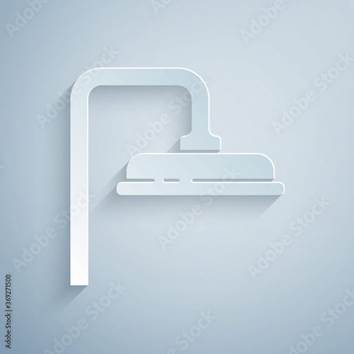 Paper cut Shower head with water drops flowing icon isolated on grey background. Paper art style. Vector Illustration.