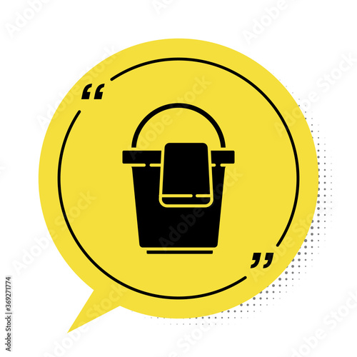 Black Bucket with rag icon isolated on white background. Cleaning service concept. Yellow speech bubble symbol. Vector Illustration.