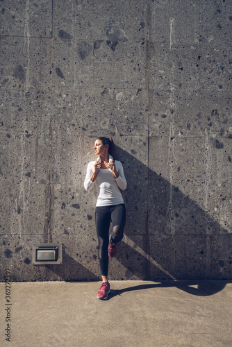 Athletic woman training in the urban area.