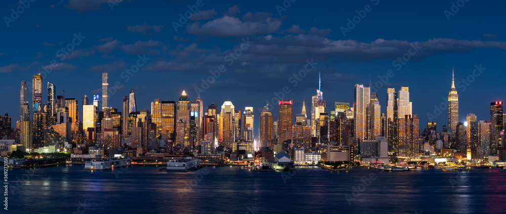 Sunset on the skyline of Midtown West, Manhattan from across Hudson River. New York City, NY, USA
