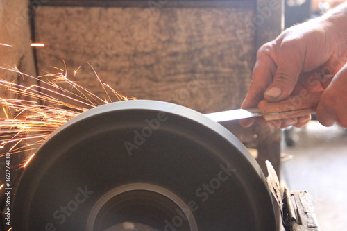 Sparks grinding wheel while knife sharpening